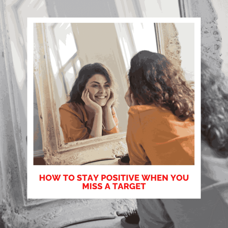 Woman smiling at her reflection in mirror, promoting positivity and self-love.