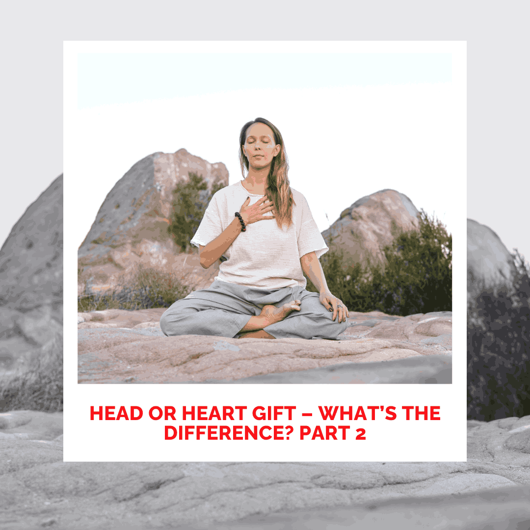 Woman meditating outdoors on rocks for healing and mindfulness practice.