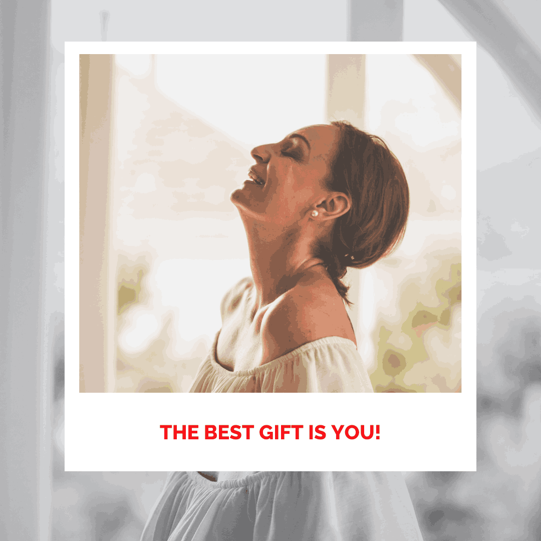 Woman smiling with eyes closed, experiencing inner peace and happiness.