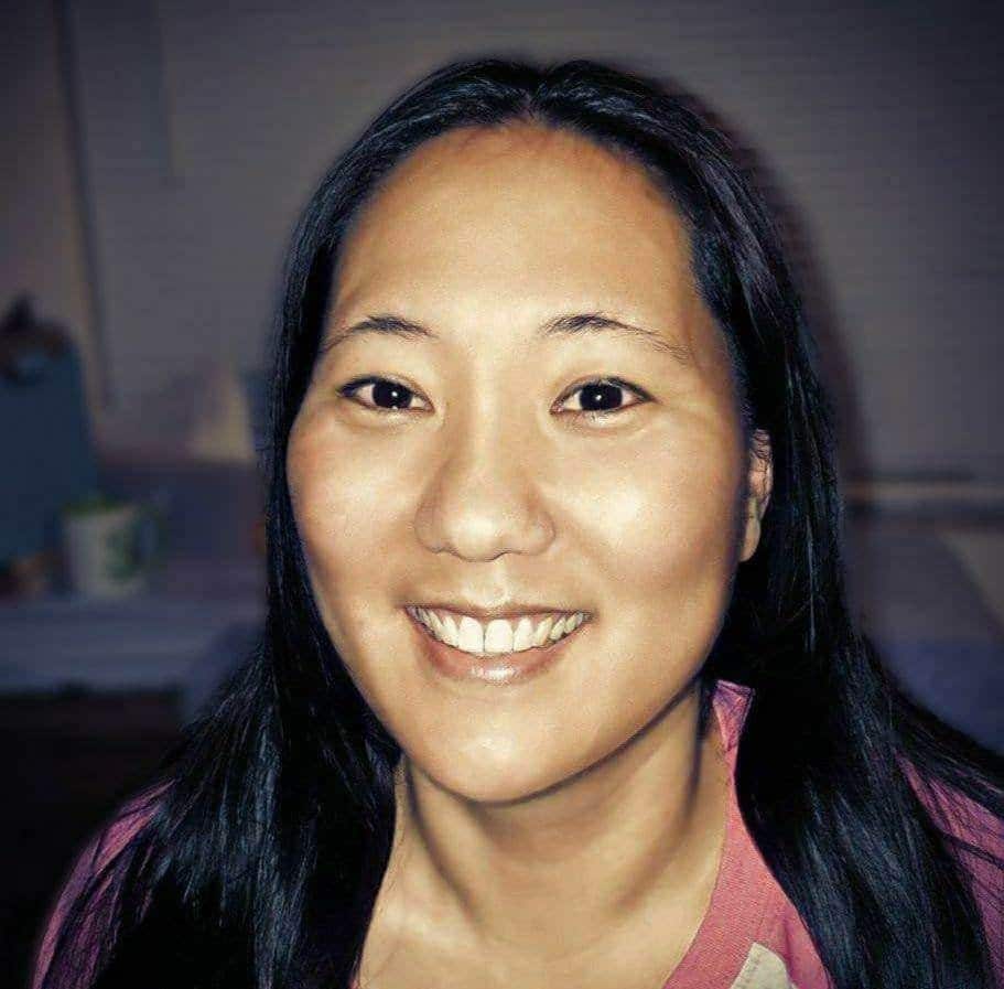 Woman smiling, promoting healing and wellness in the Souls Healing Humanity community.