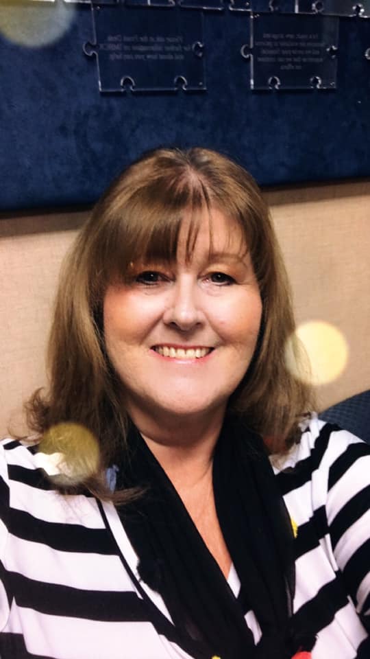 Woman smiling with FUNFU Workbook, promoting healing and self-discovery.