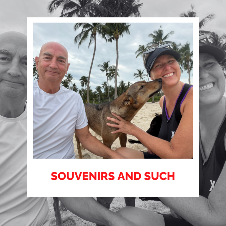 Laura Foster and David with a dog we named "Dingo" on a beach in Ko Samui, Thailand - with palm trees, smiling and enjoying nature.